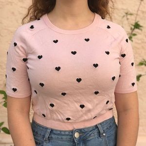 Pink top with small black heart detailing